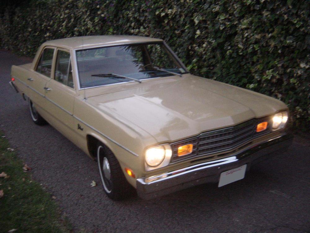 1974 Plymouth Valiant with headlights, amber front position lights, and side marker lights lit