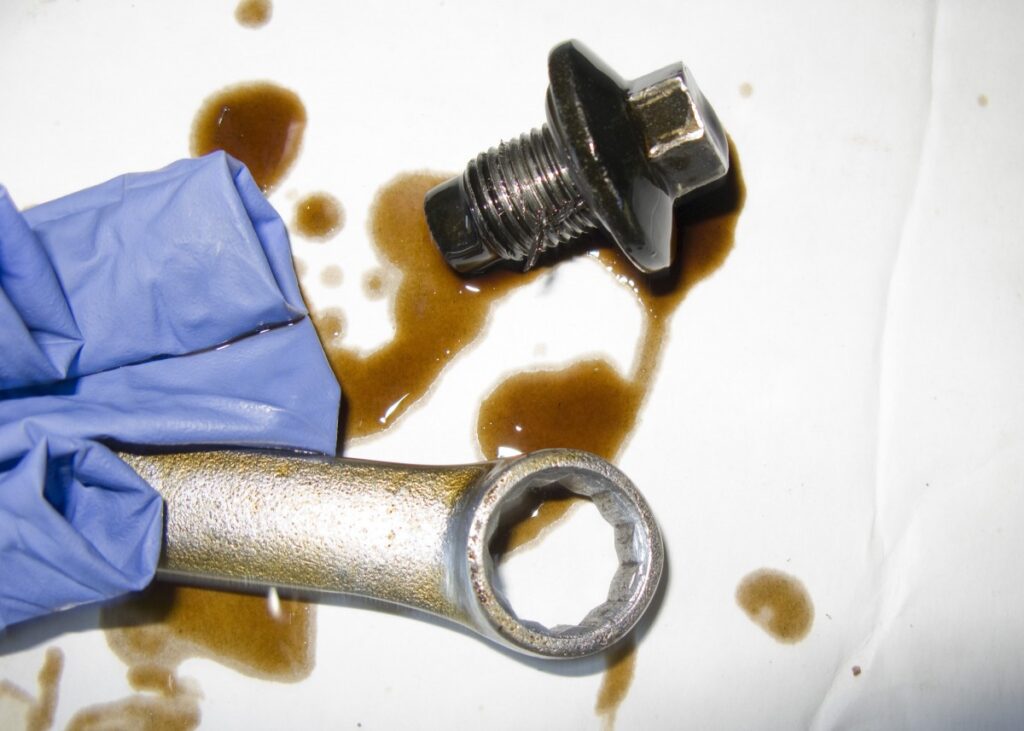 a sump plug and a wrench