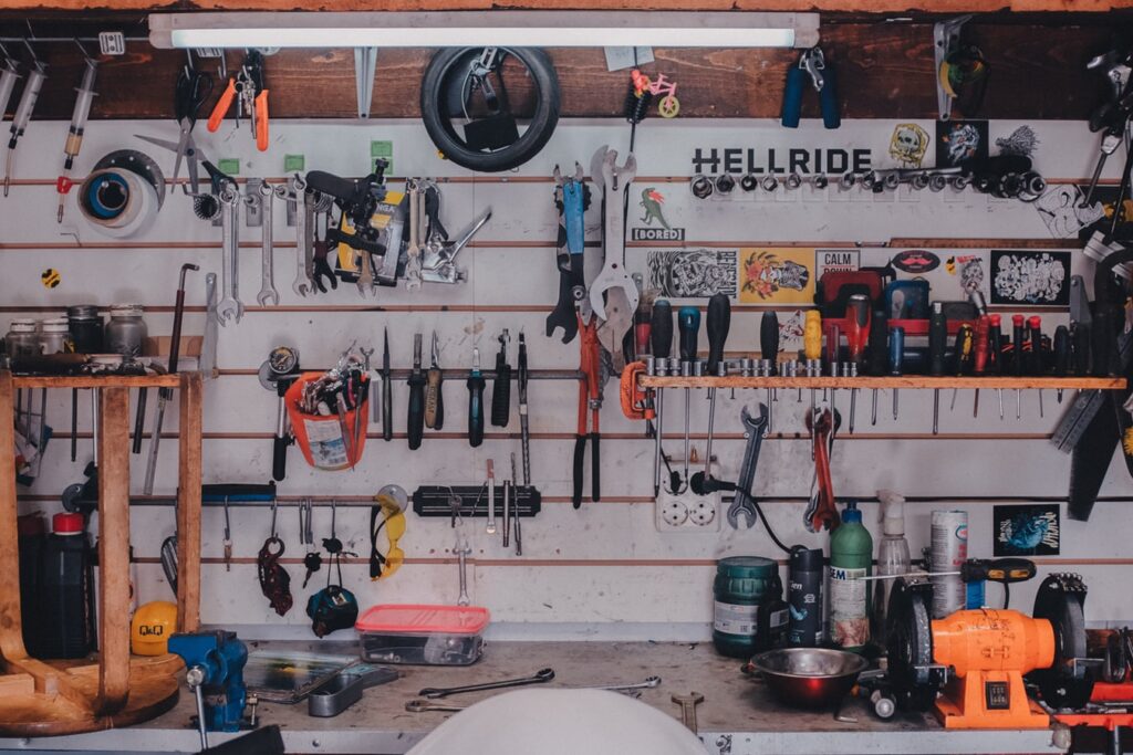 mechanical tools hanged on a wall and some on shelf