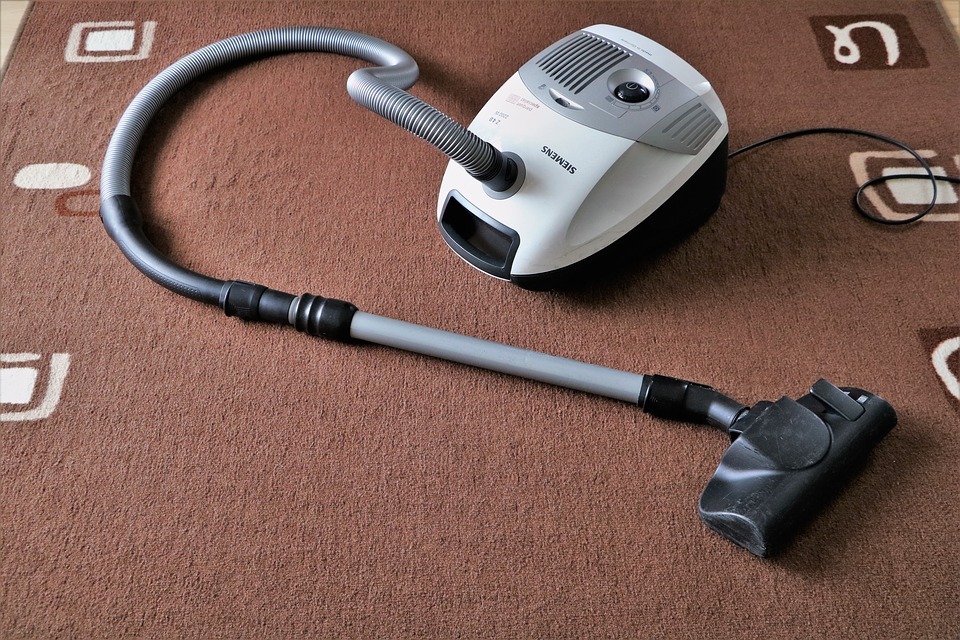 a vacuum cleaner on a carpet