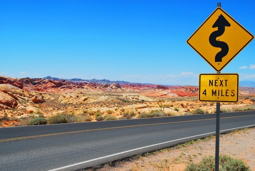 a road sign along a desert highway