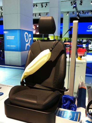 An airbag integrated with the seat of the passenger