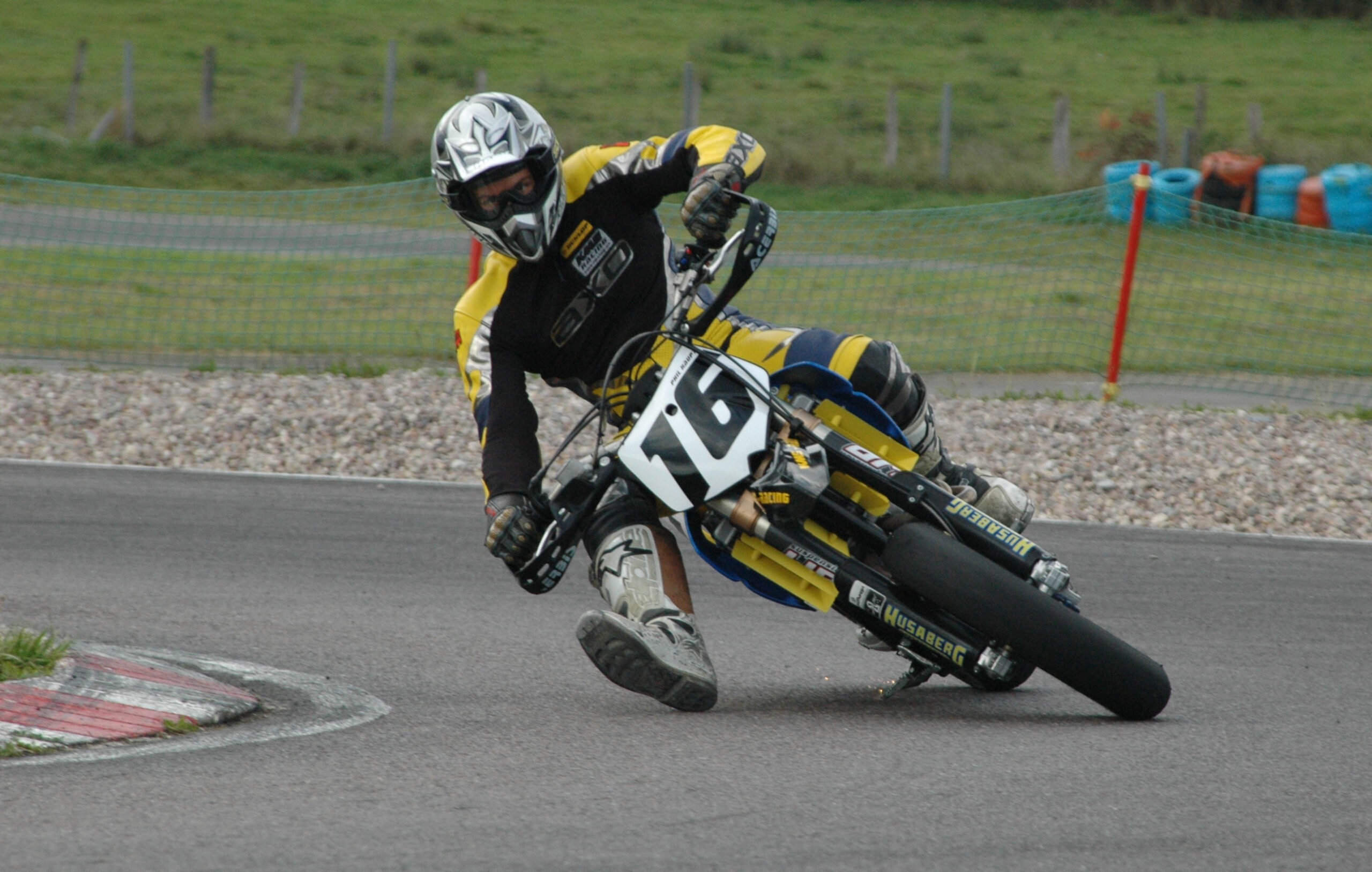 A Supermoto rider on a tarmac section 