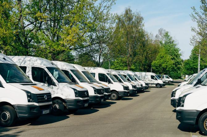 A bunch of product delivery refrigerated vans.