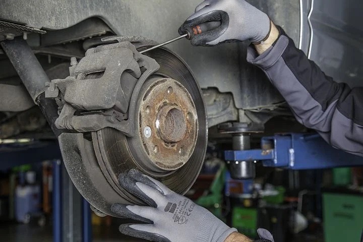 Mechanic checking brake pads