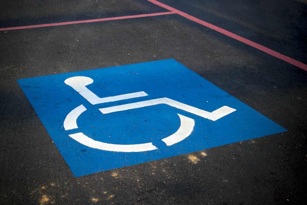 disabled sign in a parking lot