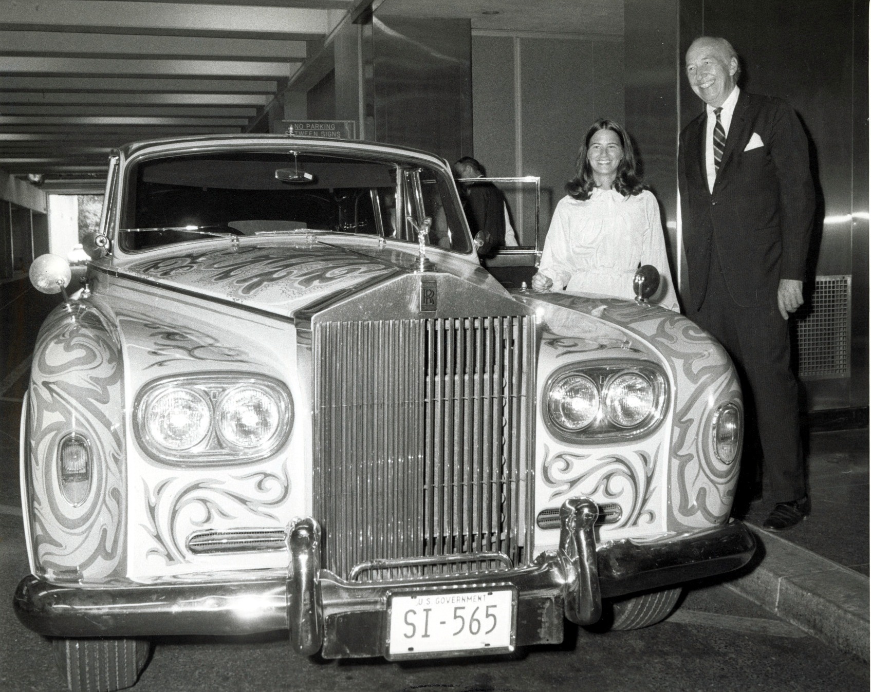 Secretary S. Dillon Ripley shows the Beatles' Rolls-Royce to Caron Carter