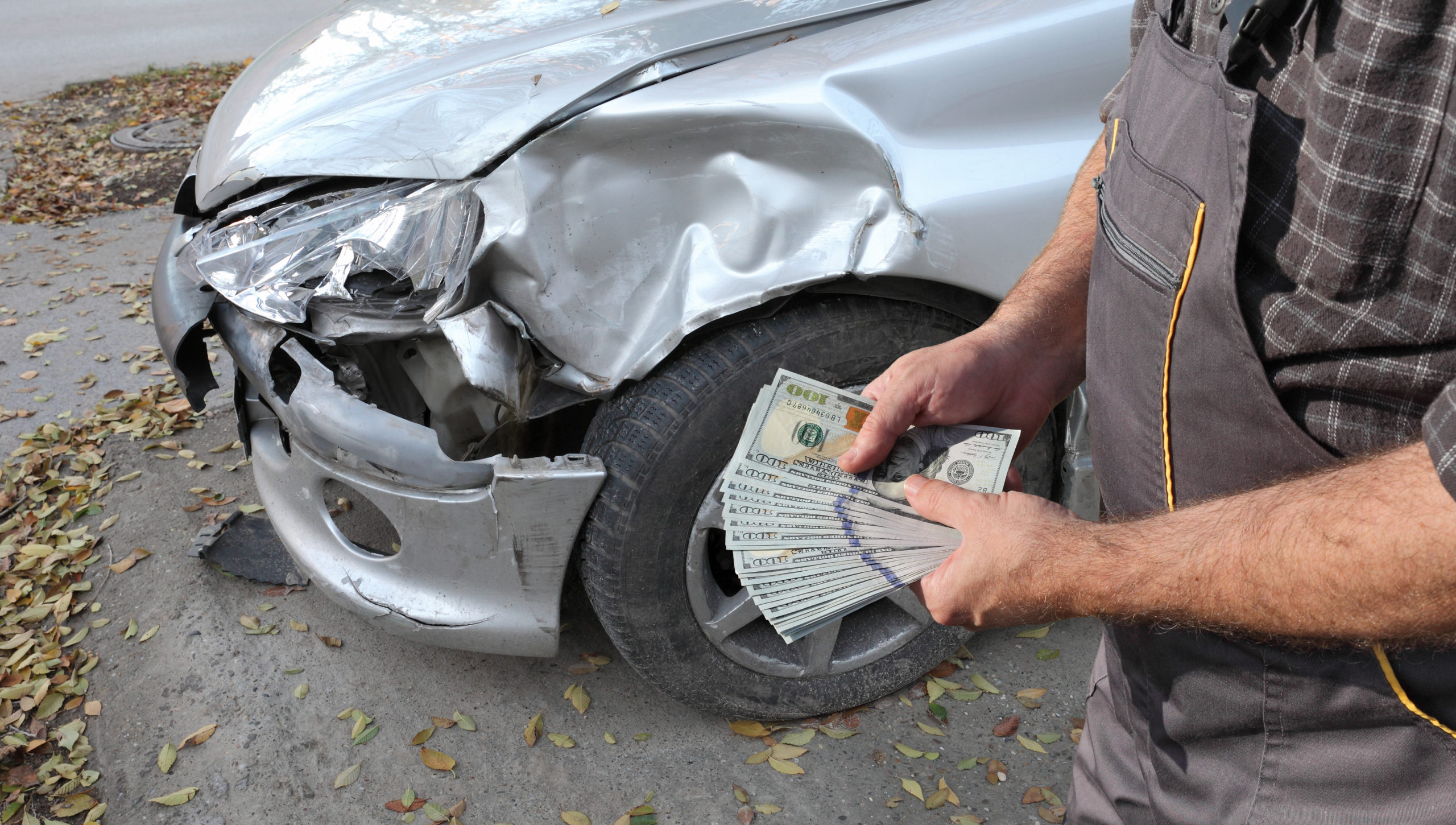 Car mechanic and damaged car