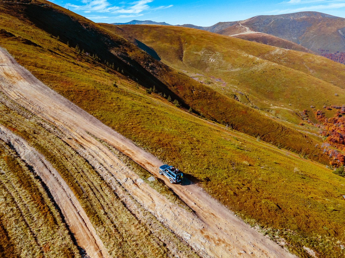 Aerial view of off road attraction road to the top of carpathian mountains