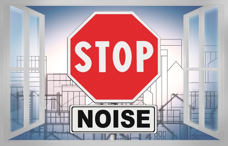 Stop Noise written on roadsign - concept with an open window against a cityscape