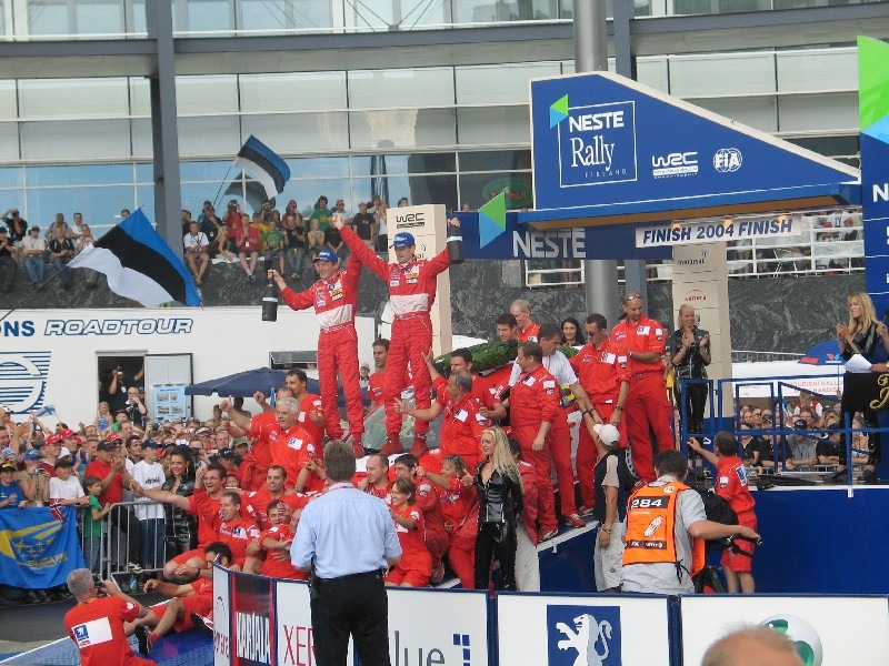 Marcus Grönholm and Peugeot Sport celebrate 2004 win