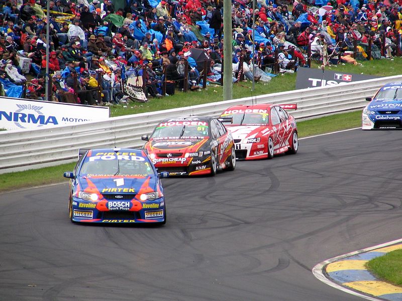 The Ford BA Falcon of Marcos Ambrose and Warren Luff leads a train of cars during the 2005 race.