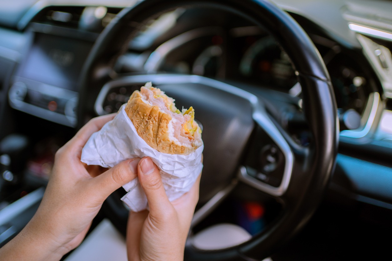 eating sandwich in a car