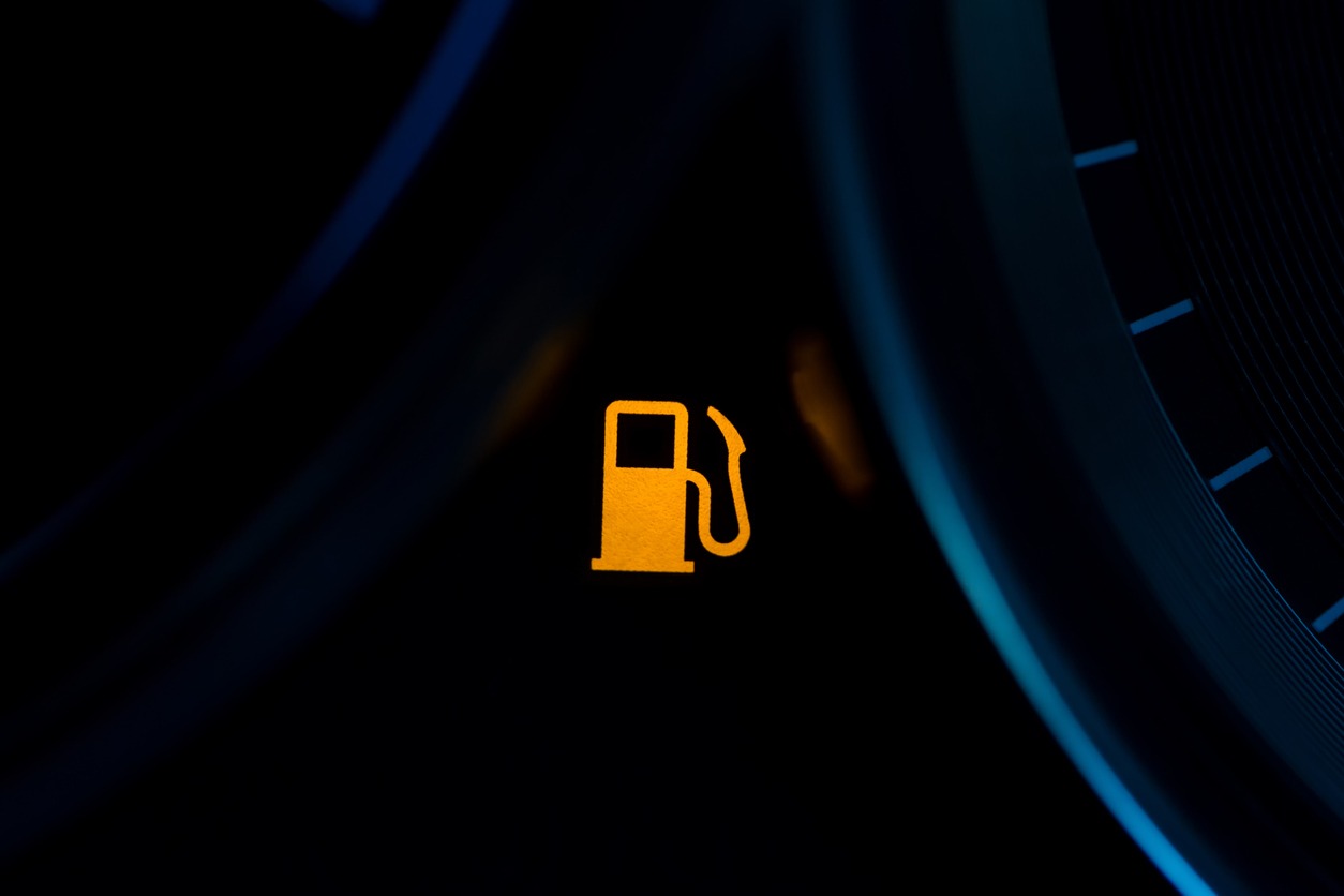 low fuel warning light in car dashboard