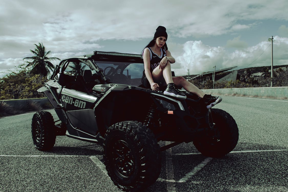 woman sitting on a black buggy