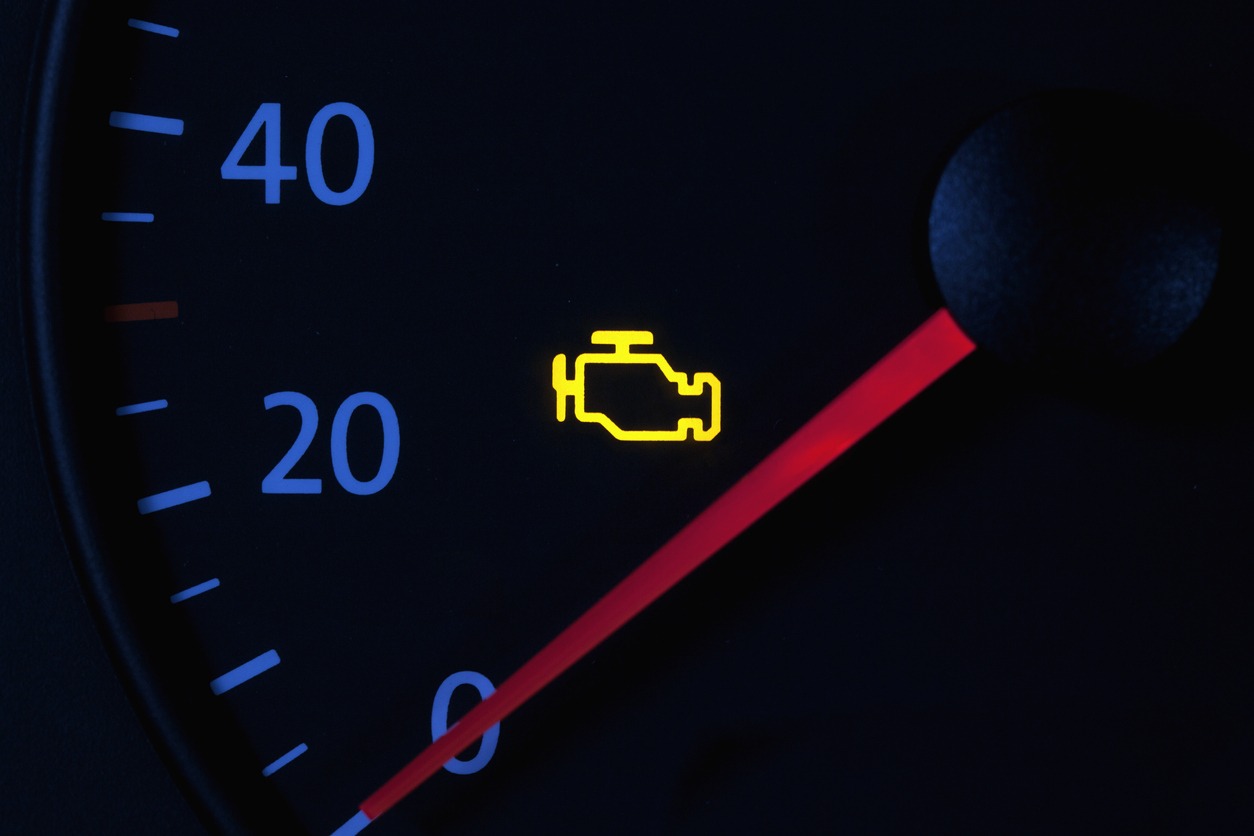 yellow engine check engine icon on car dashboard