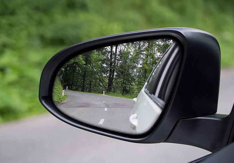 Dual-contour side mirror. Large inboard convex surface is separated from the small outboard aspheric surface