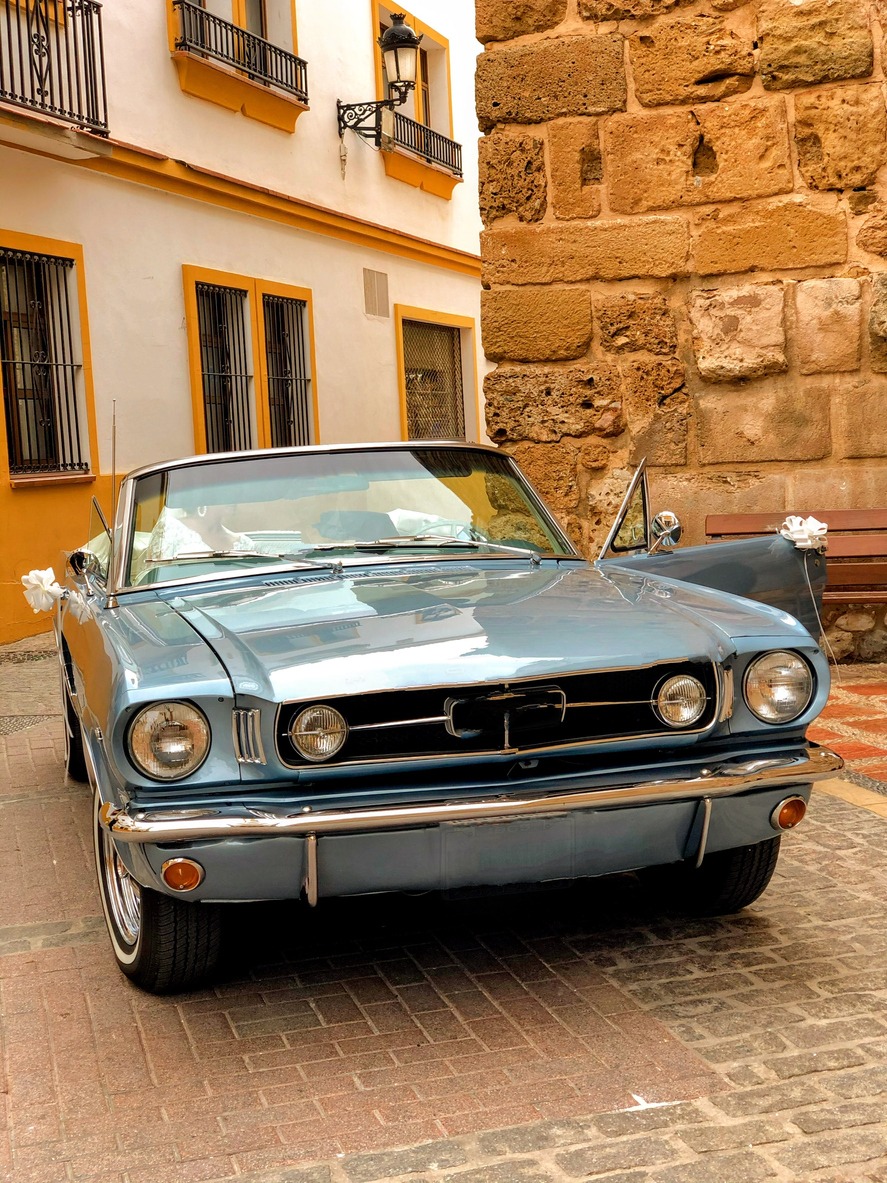 a classic car waiting on an Italian courtyard