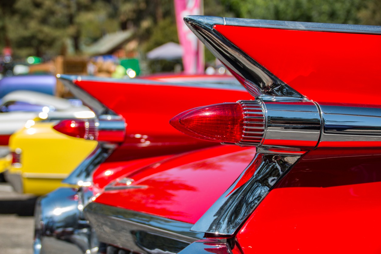 the classic styling of a 1959 Cadillac, with tail fins and bullet taillights